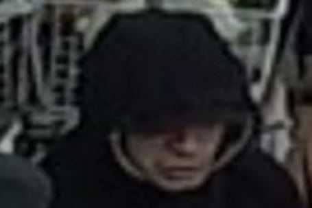 CCTV image of person in black hoodie