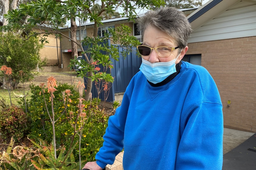 An old woman with one lense in her glasses.