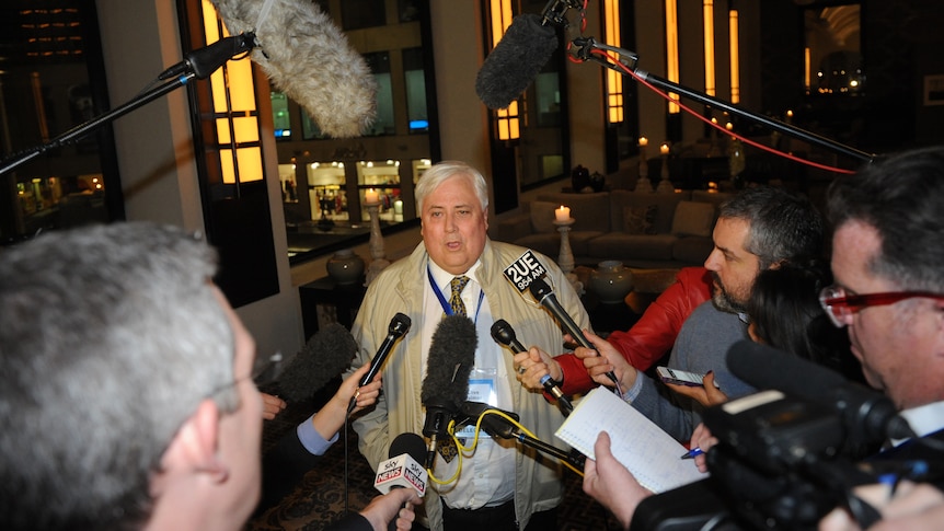 Clive Palmer speaks to journalists at the Liberal Party of Australia Federal Council at the Sofitel Hotel in Melbourne