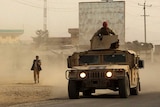 Afghan security forces travel as battles with the Taliban continue