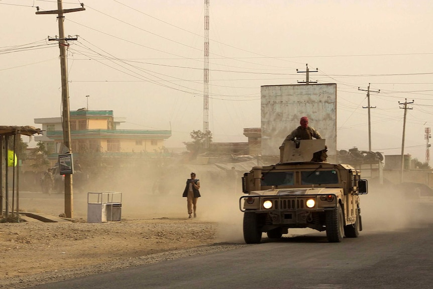 Afghan security forces travel as battles with the Taliban continue