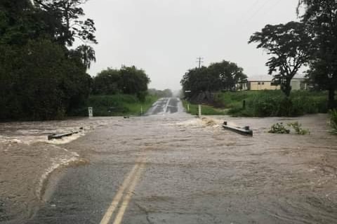 a rural road has been flooded with water