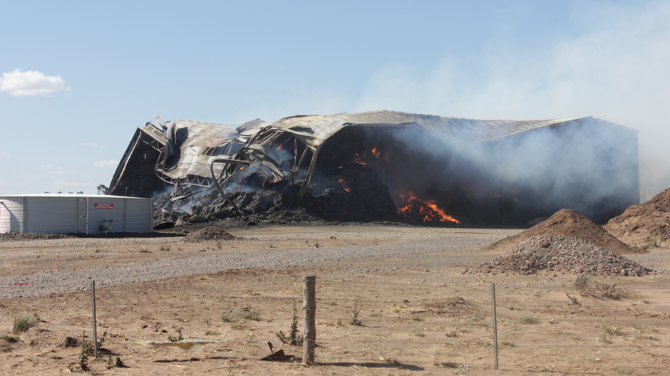 Burning hay shed