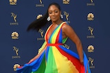 Tiffany Haddish twirls in her rainbow dress.