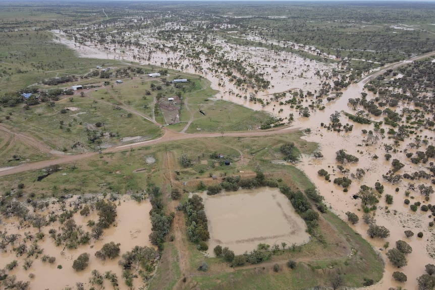 Aerial shot of property surrounded by water