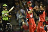 Renegades team members high five during a Big Bash League T20 match against the Sydney Thunder.