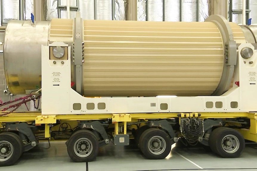 canister used to store spent nuclear waste on wheels inside a facility