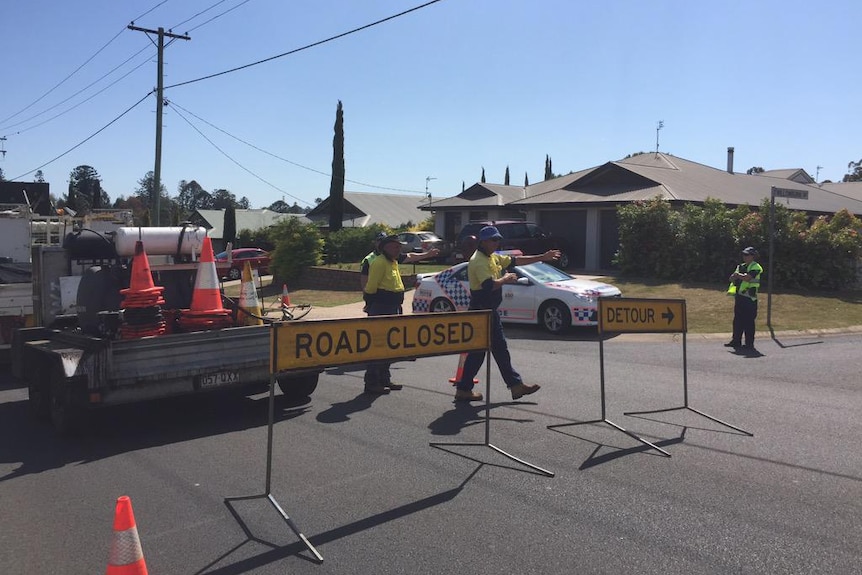 Police cordon off street in Toowoomba after suspicious device found near a bottle shop.