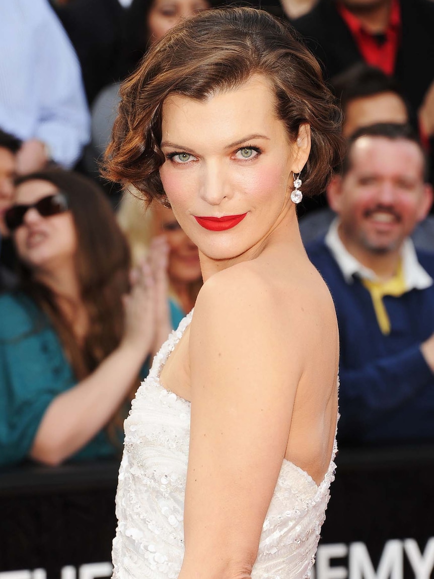 Milla Jovovich arrives at the 84th annual Academy Awards