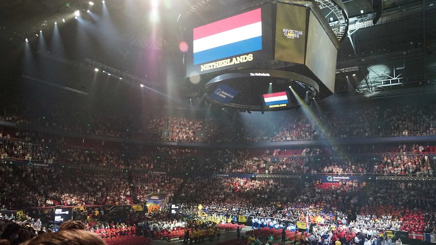 A screen displays the Netherlands flag above a packed stadium.