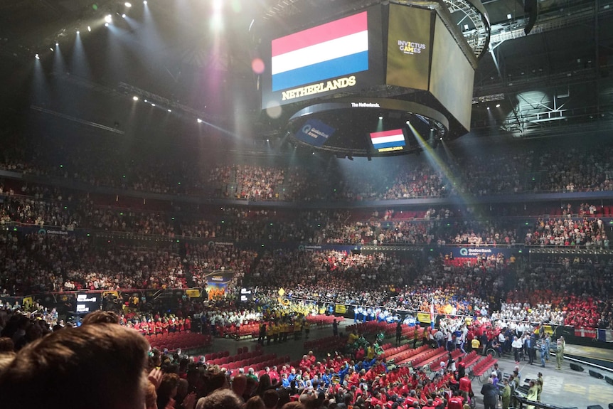 A screen displays the Netherlands flag above a packed stadium.