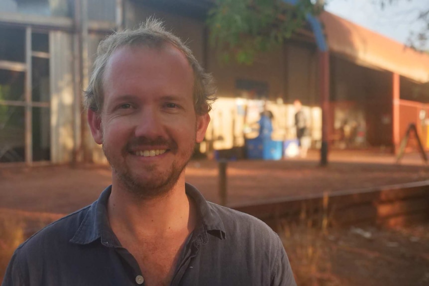 Rowan McIntyre is standing in front of the fish markets in Maningrida.