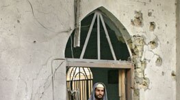 The damaged entrance of a mosque after it was shelled by US forces in Fallujah earlier today.