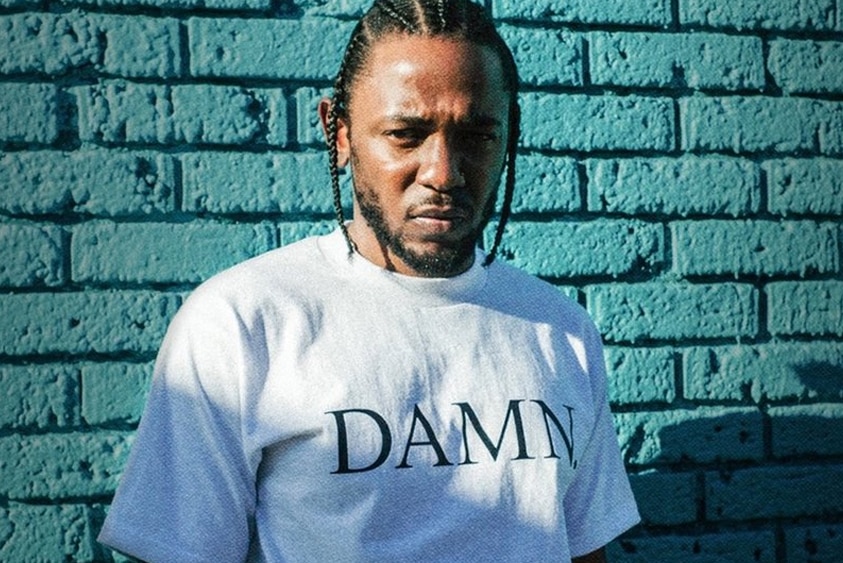 A 2017 press shot of Kendrick Lamar wearing a DAMN shirt