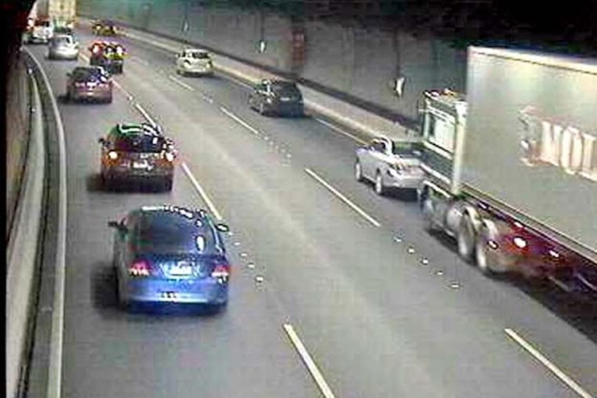 CCTV footage shows the truck (right) travelling on the bumper of the other car.