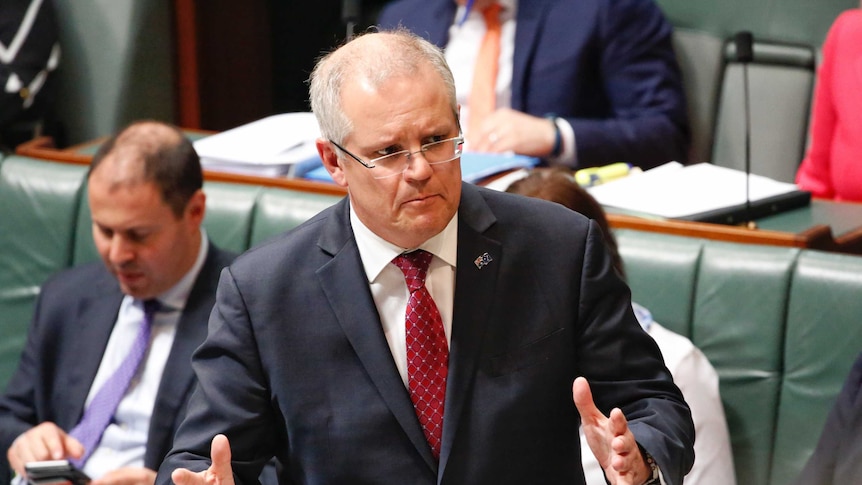 Treasurer Scott Morrison gestures with both hands in Question Time