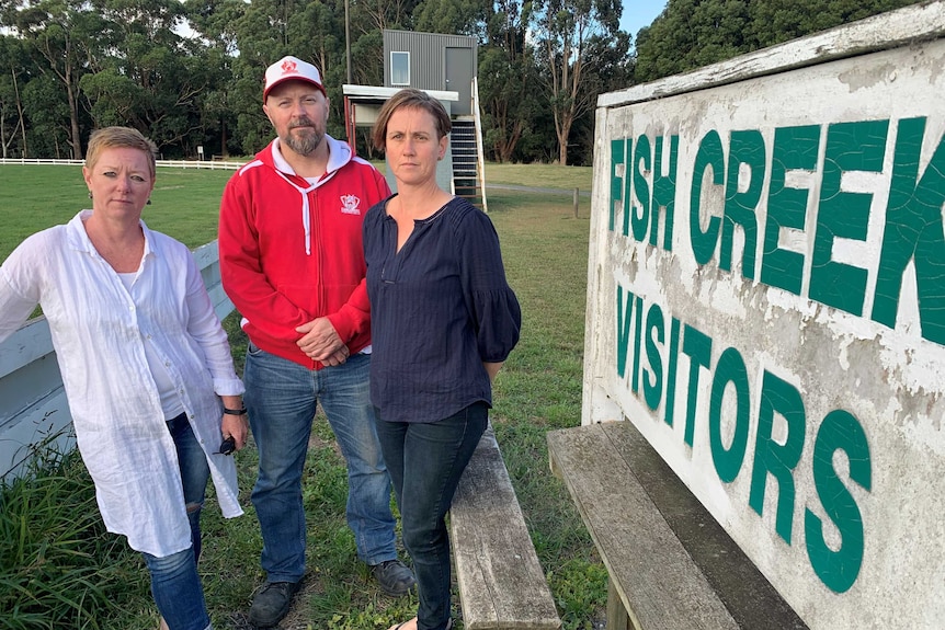 Megan Vuillermin (front), secretary Jacqui Tracy and president Jason Harding at the Fish Creek football ground.