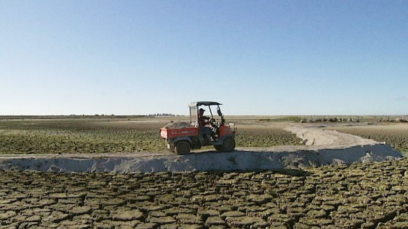 Fine limestone is put on the exposed soil