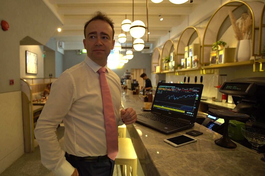 Nick Ferres has his laptop on a cafe counter