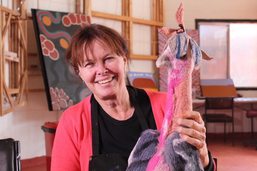 Jane Easton holds up a felted galah.