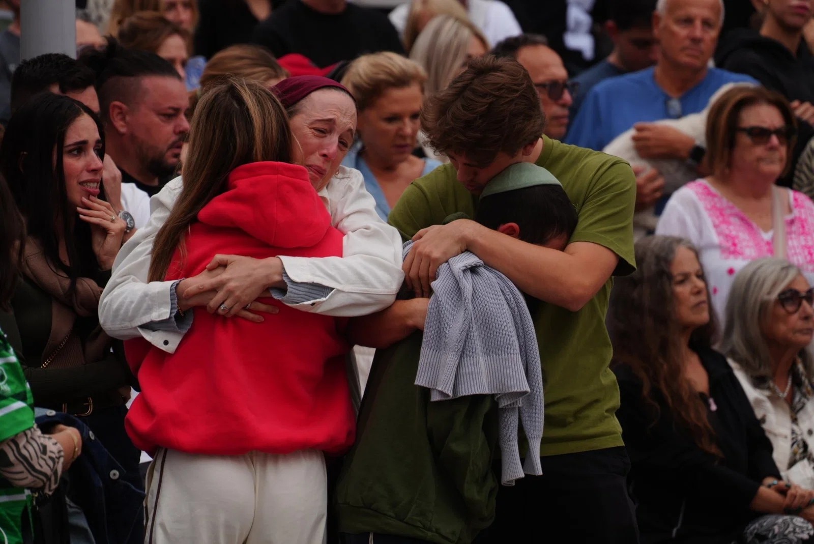 ‘Wrap our arms around': Is this the new language of Australian grief?