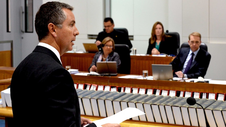 Simon Corbell listens to Jeremy Hanson speak during the Marriage Equality Same-Sex Bill debate.