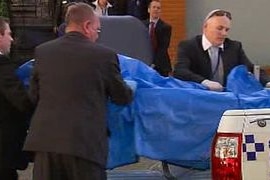 The massage table was taken away for examination after the death
