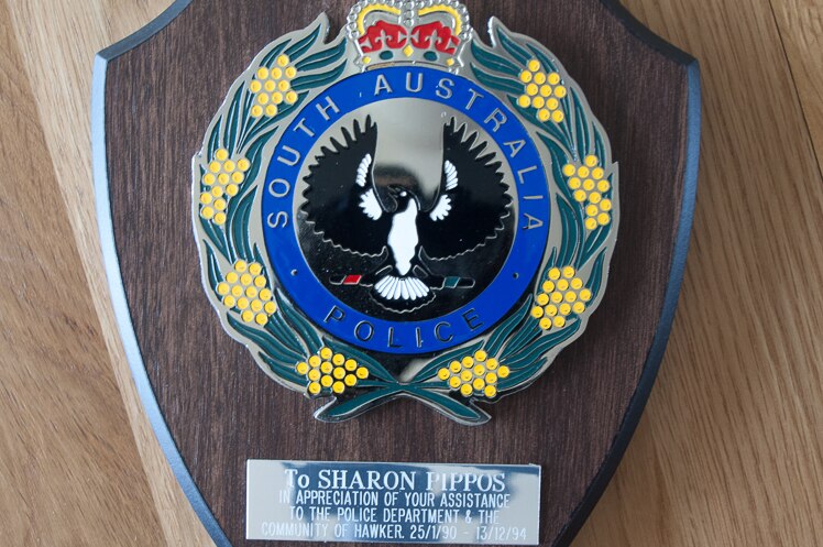 A plaque given to Ms Pippos in appreciation of her contributions during her husband's time at the Hawker police station.