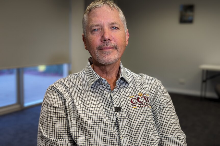 A man with grey hair and a shirt that reads "CCW".