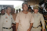General Manas Kongpaen arriving at the Criminal Court in Bangkok in 2015.