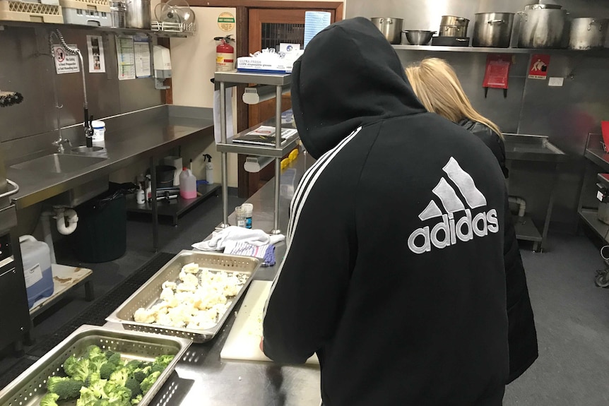 A patient stands in a hoodie in the kitchen at Arrow Health's rehabilitation centre in Woodend