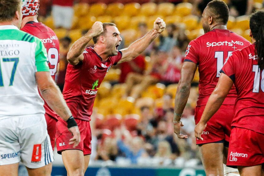 Reds half-back Nick Frisby celebrates a rare Australian victory over the Highlanders in 2016.