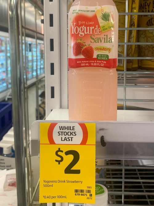 A soft drink product on a supermarket shelf at Coles with a "While Stocks Last" tag.