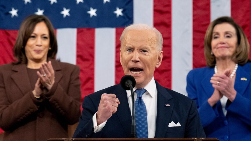 Joe Biden pumps his fist during his first State of the Union address in Washington DC.