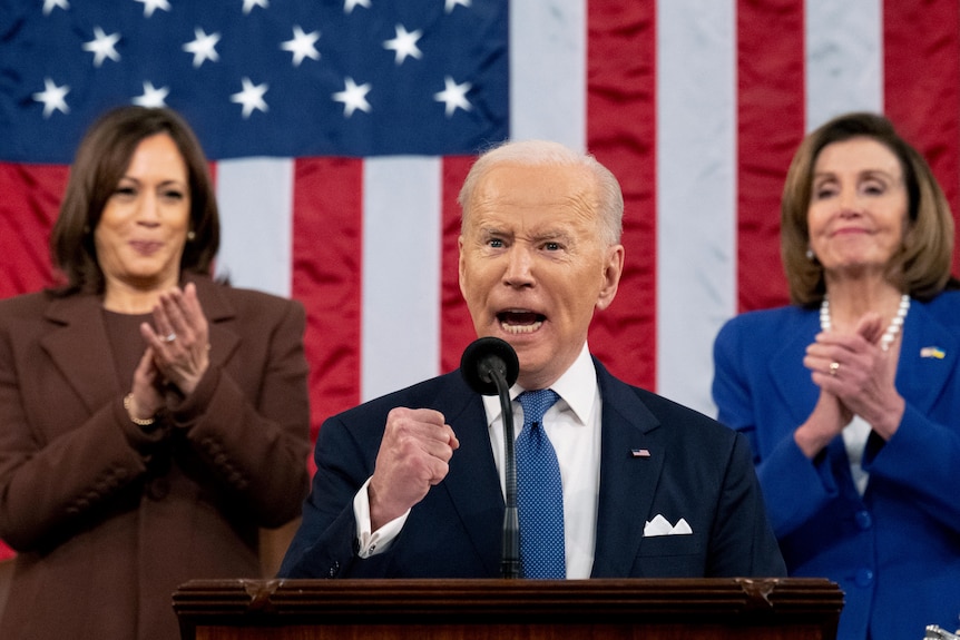 Joe Biden pumps his fist during his first State of the Union address in Washington DC.