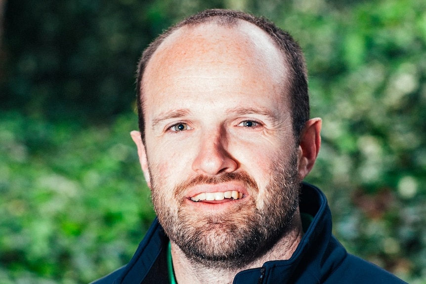 Headshot of a man with a beard.