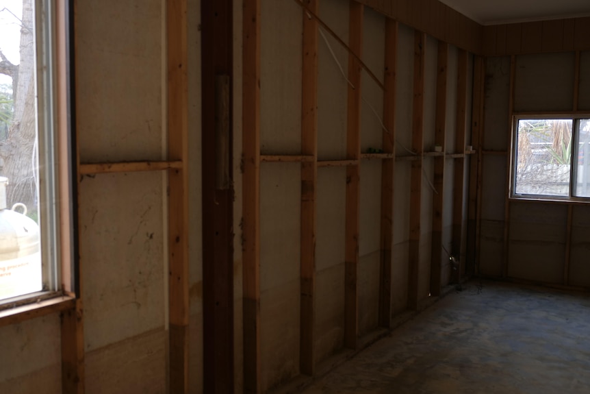 A picture of inside a house with a water mark showing where flood waters reached in the property. 