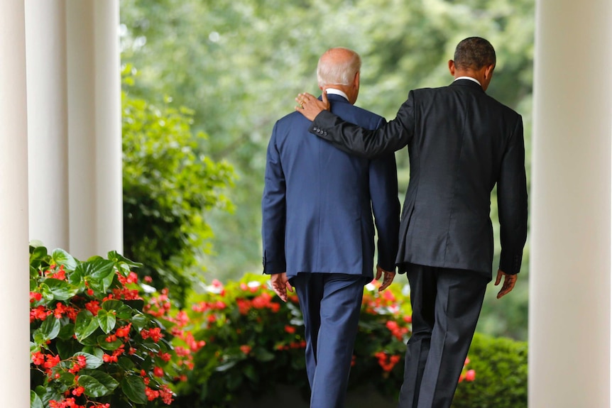 US President Barack Obama and Vice President Joe Biden walk back to the Oval Office, mr obama's arm over mr biden's shoulder