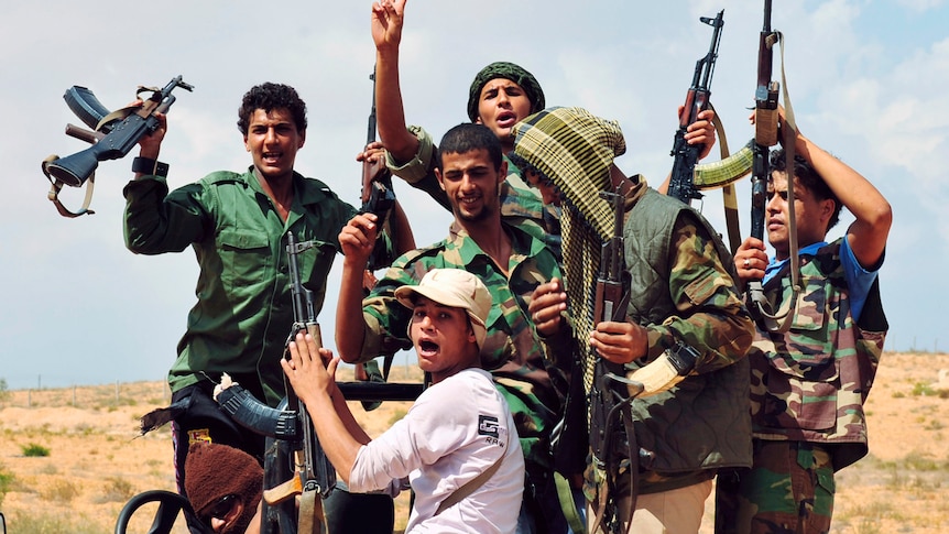 Key victory: anti-Gaddafi fighters celebrate in Sirte