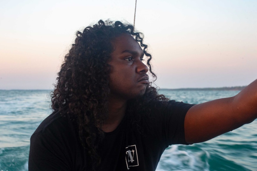 Danzal Baker with the sea behind him