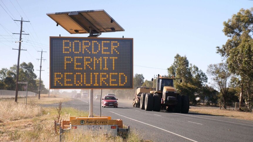 A roadside sign informs people to have a border permit to enter Victoria.