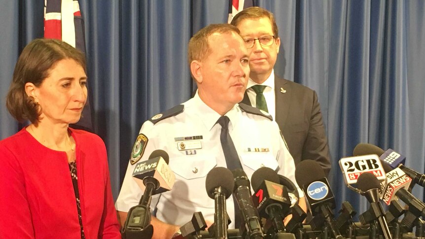 NSW Police Commissioner Mick Fuller (centre) said he will be reforming the police force immediately.