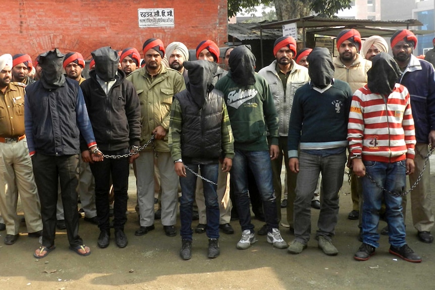 Indian police present six arrested men, accused of a gang rape in Punjab state.