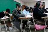 Middle school students take part in a history class in South Korea.