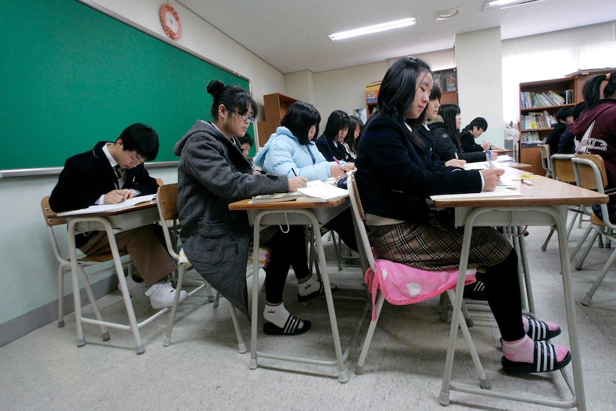 Middle school students take part in a history class in South Korea.