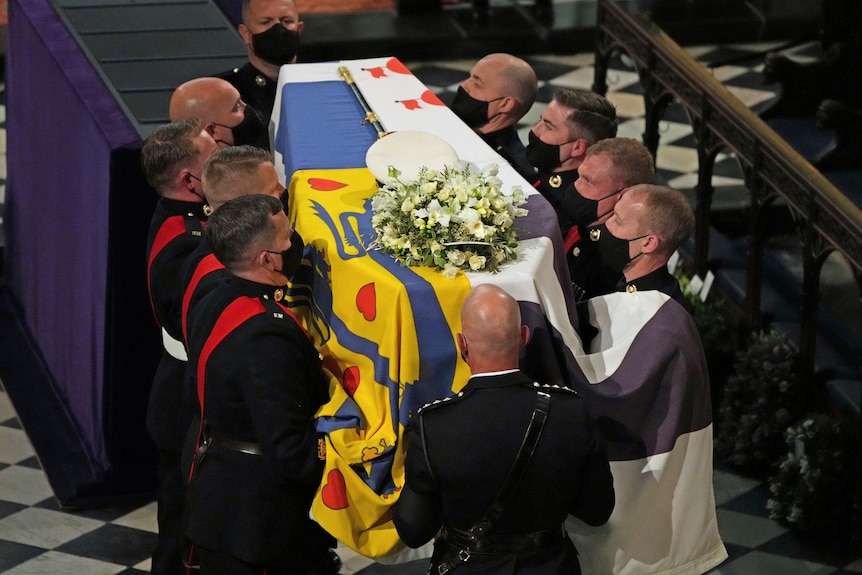 Prince Philip's coffin is carried into St George's Chapel.