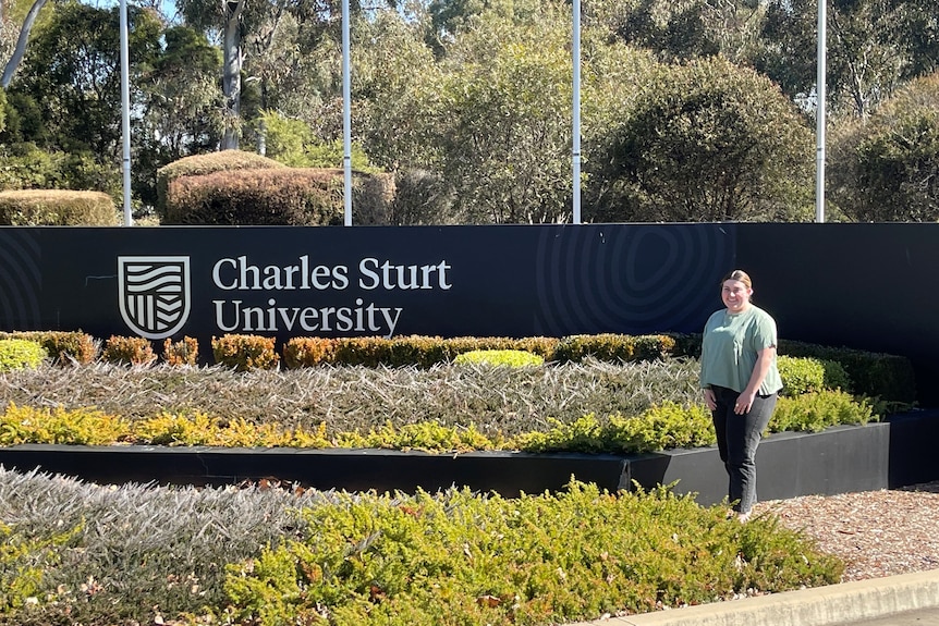 Young woman standing outside Charles Sturt University