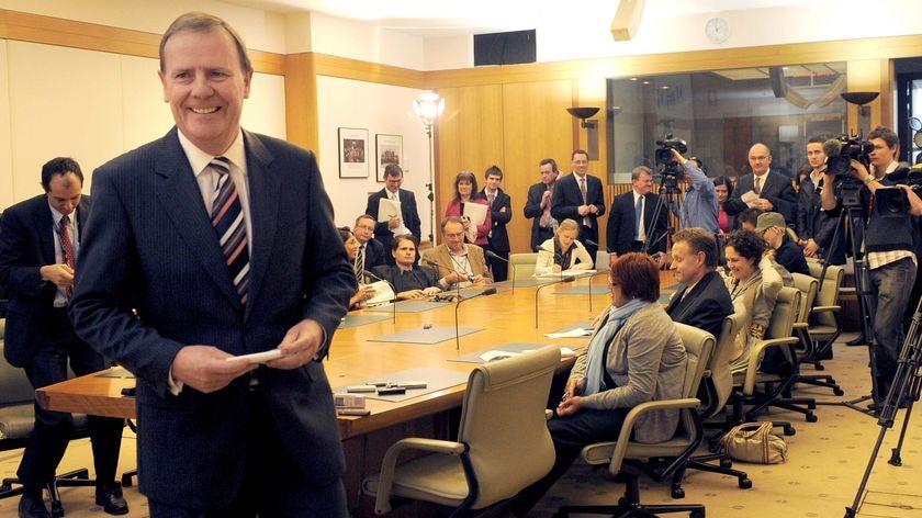 Former treasurer Peter Costello leaves a press conference