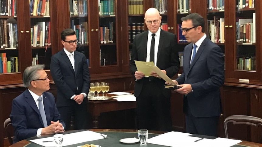 Governor Hieu Van Le watches as Steven Marshall takes the oath to become SA Premier.