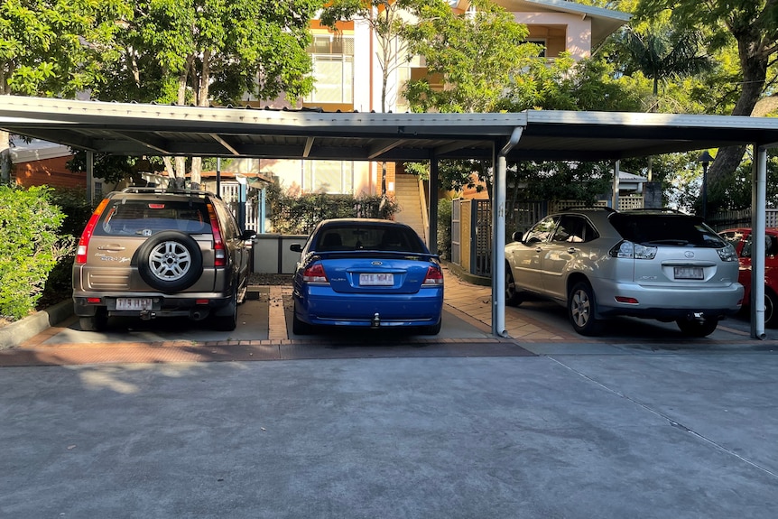 Four occupied, undercover car parks at a unit complex in Brisbane.